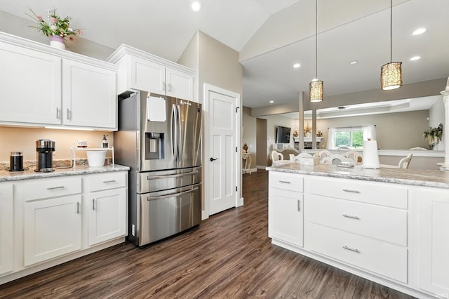 17009 Hamptons Pkwy, New Haven, IN 46774 - kitchen featuring stainless steel fridge, dark wood-type flooring, white cabinetry, lofted ceiling, and pendant lighting