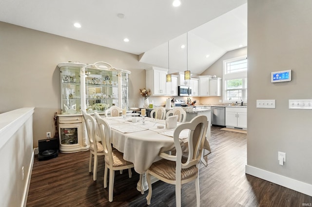 17009 Hamptons Pkwy, New Haven, IN 46774 - dining area featuring dark wood-style floors, baseboards, lofted ceiling, and recessed lighting