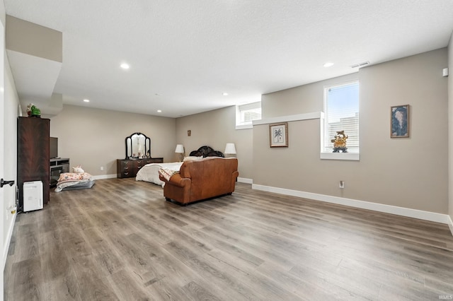 17009 Hamptons Pkwy, New Haven, IN 46774 - living room featuring wood finished floors, recessed lighting, and baseboards
