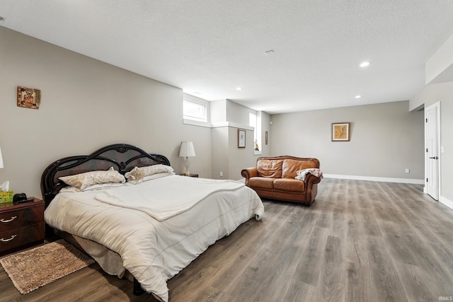 17009 Hamptons Pkwy, New Haven, IN 46774 - bedroom with wood finished floors, recessed lighting, and baseboards