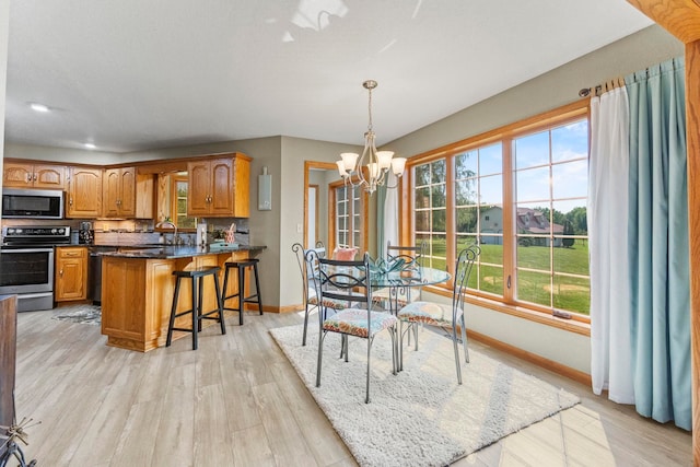 6378 N 100 E, Ossian, IN 46777 - dining room with baseboards, a chandelier, light wood-style flooring, and recessed lighting