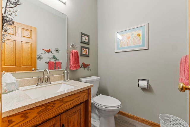 6378 N 100 E, Ossian, IN 46777 - bathroom featuring wood finished floors, toilet, vanity, and baseboards