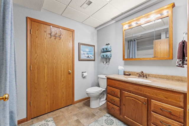 6378 N 100 E, Ossian, IN 46777 - bathroom featuring vanity, a paneled ceiling, toilet, a shower with curtain, and stone finish flooring