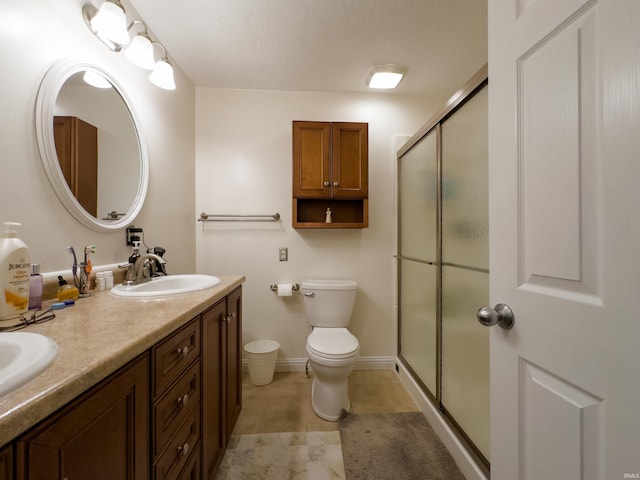 4604 Mayfield Dr, Kokomo, IN 46901 - full bath featuring double vanity, a shower with shower door, and toilet