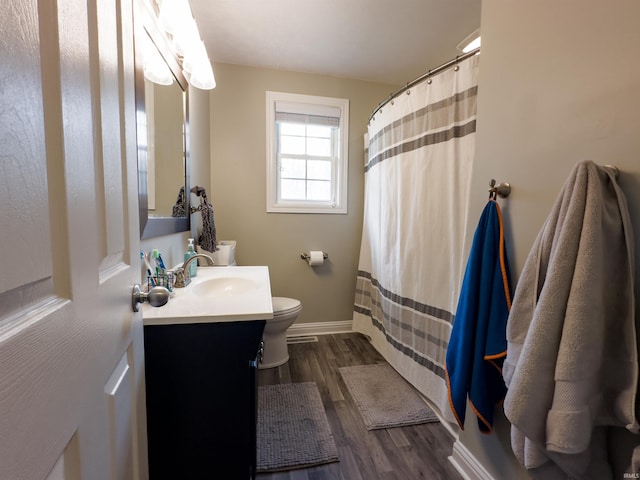 4604 Mayfield Dr, Kokomo, IN 46901 - bathroom featuring vanity, toilet, baseboards, wood finished floors, and a shower with curtain