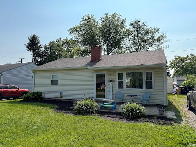 2520 Foxhall Dr, Lafayette, IN 47909 - view of front of house with a front yard and a chimney