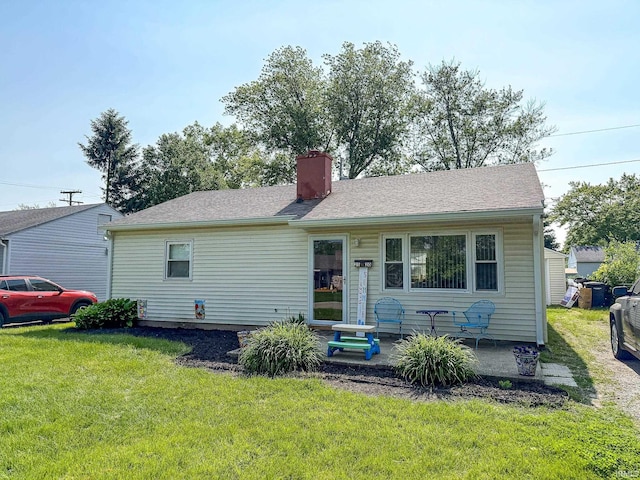 2520 Foxhall Dr, Lafayette, IN 47909 - view of front facade featuring a front yard and a chimney