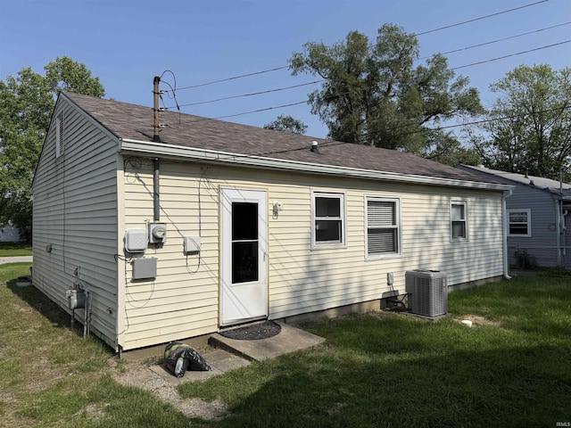 2520 Foxhall Dr, Lafayette, IN 47909 - rear view of house with cooling unit, a lawn, and a shingled roof