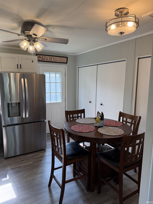 2520 Foxhall Dr, Lafayette, IN 47909 - dining space featuring crown molding, ceiling fan, a decorative wall, and dark wood finished floors