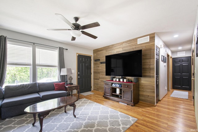 907 Eagle Blvd, Bristol, IN 46507 - living area featuring wooden walls, an accent wall, ceiling fan, light wood-style flooring, and recessed lighting