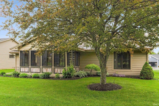 1114 Packard Pl, Auburn, IN 46706 - view of front of home with a sunroom and a front lawn
