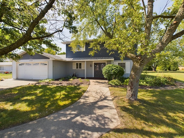 1326 Stag Dr, Fort Wayne, IN 46804 - traditional-style house featuring concrete driveway, an attached garage, and a front lawn