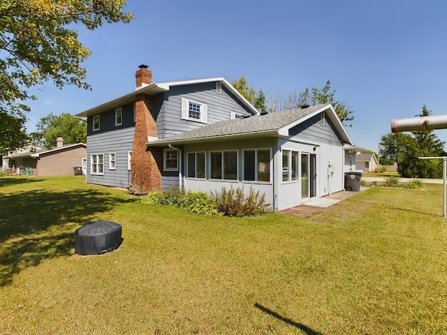 1326 Stag Dr, Fort Wayne, IN 46804 - rear view of house with a chimney, a yard, and a shingled roof