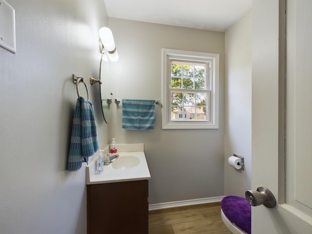 1326 Stag Dr, Fort Wayne, IN 46804 - bathroom with vanity, wood finished floors, and baseboards