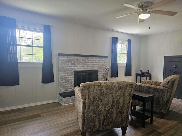 1326 Stag Dr, Fort Wayne, IN 46804 - living area with wood finished floors, a fireplace, ceiling fan, and baseboards