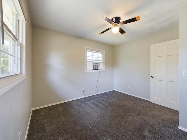 1326 Stag Dr, Fort Wayne, IN 46804 - unfurnished room featuring dark colored carpet, a ceiling fan, baseboards, and cooling unit