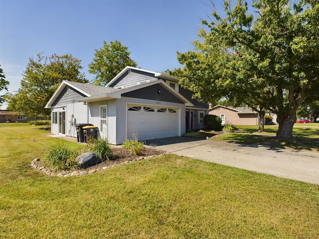 1326 Stag Dr, Fort Wayne, IN 46804 - view of front of house with an attached garage, a front lawn, and concrete driveway