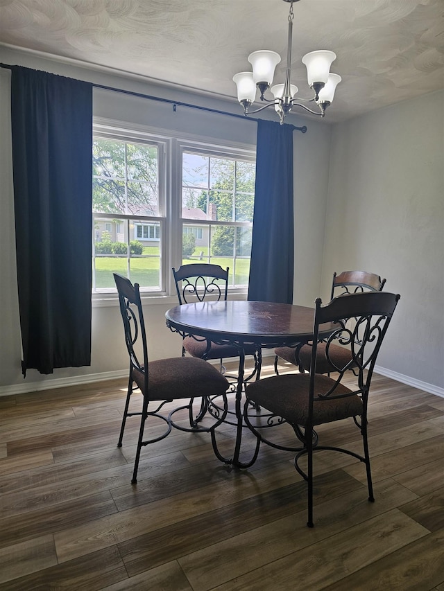 1326 Stag Dr, Fort Wayne, IN 46804 - dining space featuring a chandelier, baseboards, and dark wood-type flooring