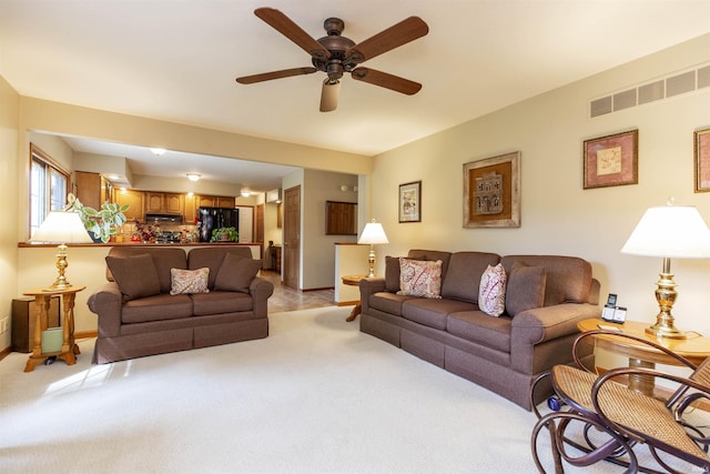 54363 Adrian Ct, Osceola, IN 46561 - living area with light colored carpet, a ceiling fan, and baseboards