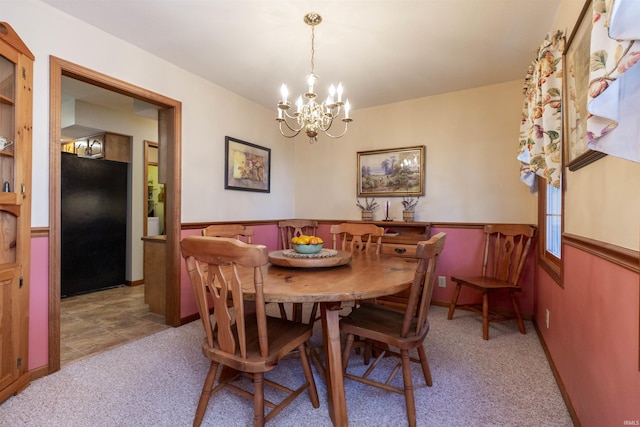 54363 Adrian Ct, Osceola, IN 46561 - dining area featuring light carpet and a chandelier