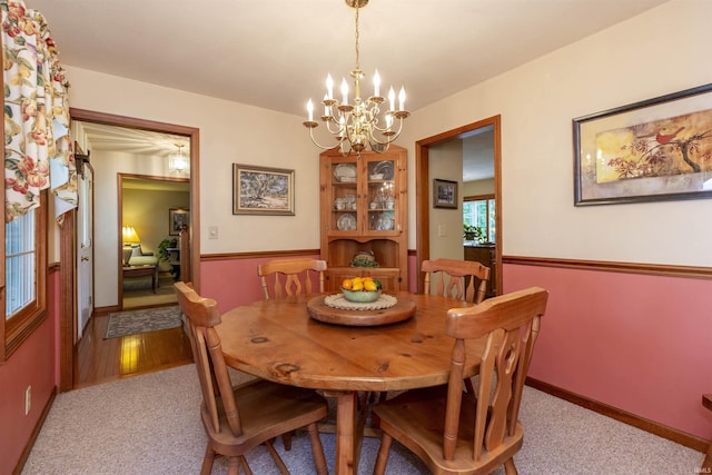 54363 Adrian Ct, Osceola, IN 46561 - dining room with a chandelier, light colored carpet, and baseboards