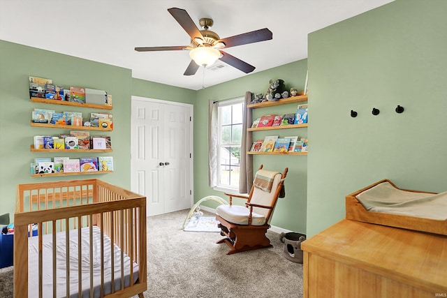 843 S Lantern Ln, Ellettsville, IN 47401 - carpeted bedroom with a closet, a crib, a ceiling fan, and baseboards