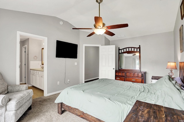 843 S Lantern Ln, Ellettsville, IN 47401 - bedroom with vaulted ceiling, light carpet, ceiling fan, ensuite bath, and baseboards