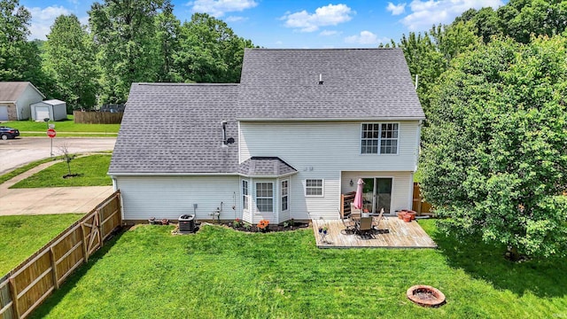 843 S Lantern Ln, Ellettsville, IN 47401 - back of property featuring cooling unit and roof with shingles