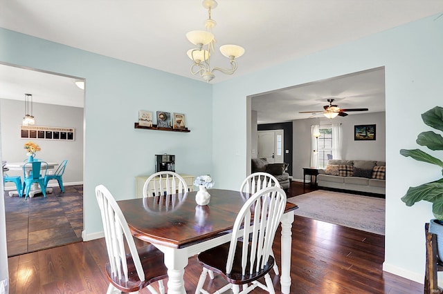843 S Lantern Ln, Ellettsville, IN 47401 - dining space featuring wood finished floors, a chandelier, a ceiling fan, and baseboards