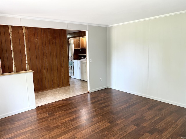 4234 Oak St, Woodburn, IN 46797 - empty room featuring separate washer and dryer, wood finished floors, crown molding, and baseboards