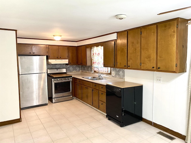 4234 Oak St, Woodburn, IN 46797 - kitchen featuring appliances with stainless steel finishes, under cabinet range hood, a sink, baseboards, and decorative backsplash