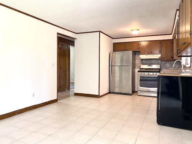 4234 Oak St, Woodburn, IN 46797 - kitchen featuring stainless steel appliances, under cabinet range hood, a sink, ornamental molding, and light countertops