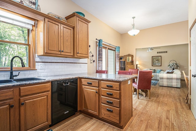 58078 Windsong Dr, Elkhart, IN 46517 - kitchen featuring black dishwasher, a sink, and brown cabinetry