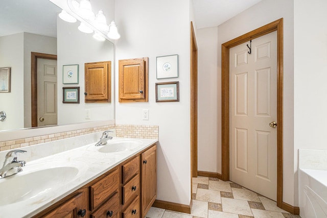 58078 Windsong Dr, Elkhart, IN 46517 - full bath featuring double vanity, a garden tub, and baseboards