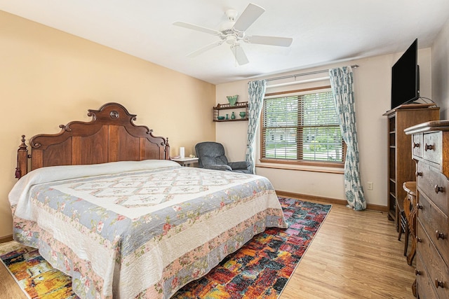 58078 Windsong Dr, Elkhart, IN 46517 - bedroom with baseboards, wood finished floors, and ceiling fan