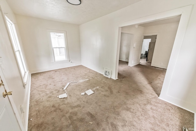 232 E Grove St, Mishawaka, IN 46545 - unfurnished room featuring carpet flooring, a textured ceiling, and baseboards