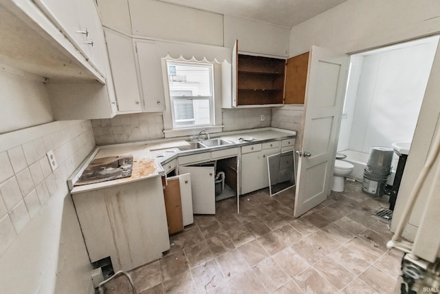 232 E Grove St, Mishawaka, IN 46545 - kitchen with light countertops, tasteful backsplash, white cabinets, a sink, and open shelves