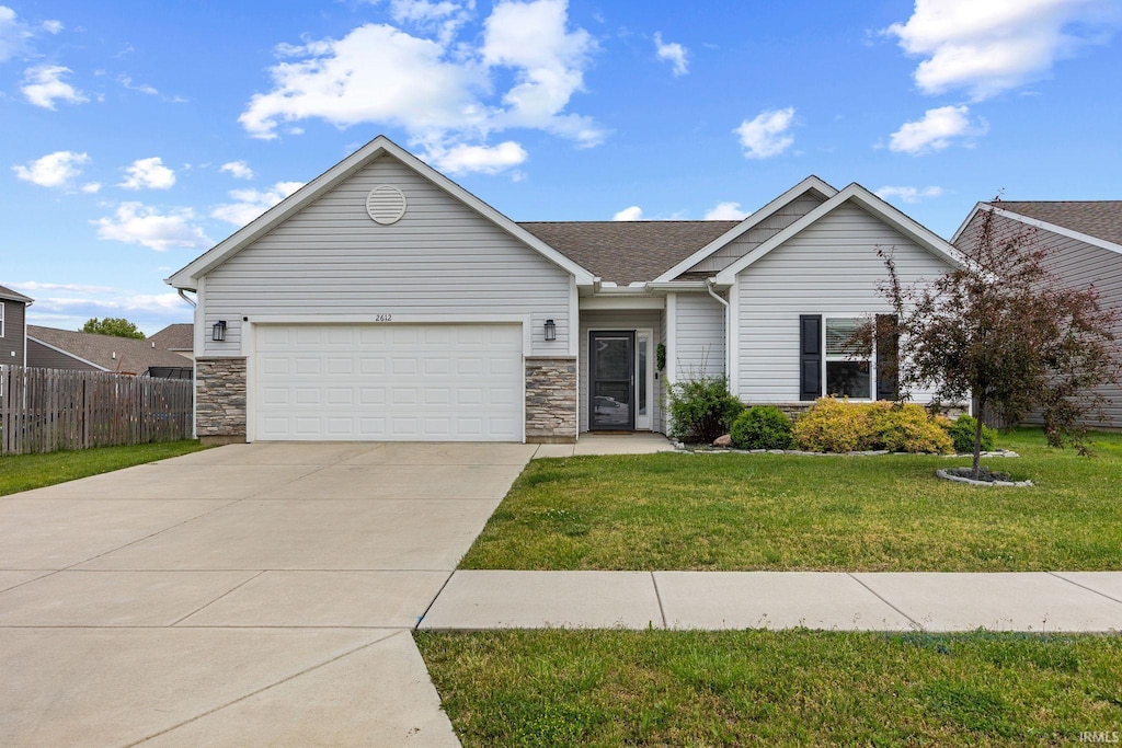 2612 Glastonbury Way, Lafayette, IN 47909 - ranch-style house featuring driveway, a garage, and stone siding