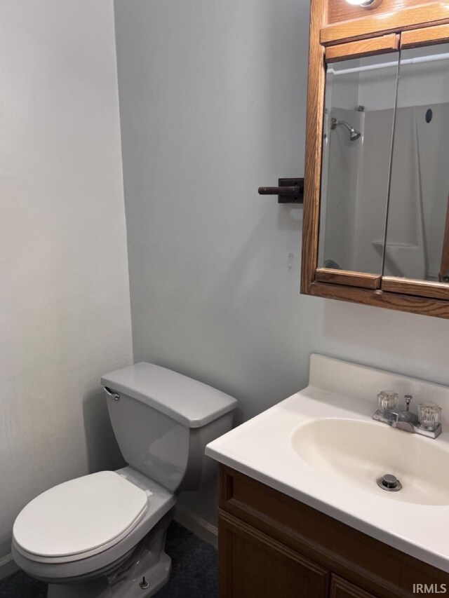 1705 Northview Blvd, Kokomo, IN 46901 - bathroom featuring toilet, vanity, and baseboards