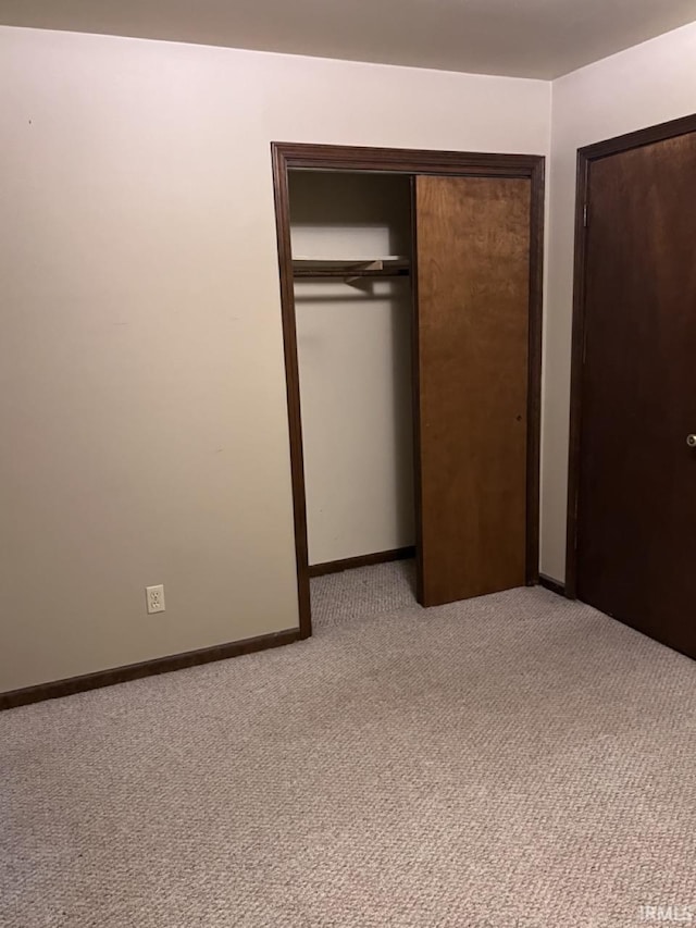 1705 Northview Blvd, Kokomo, IN 46901 - unfurnished bedroom featuring light colored carpet, a closet, and baseboards
