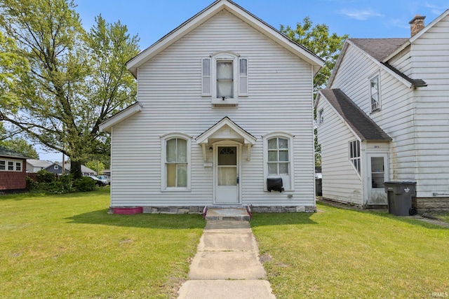 315 Division St, Elkhart, IN 46516 - traditional home with a front yard and a chimney