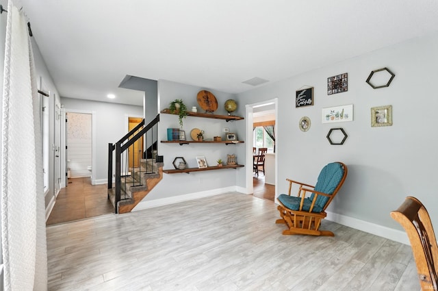 2906 Easton Ridge Pl, Fort Wayne, IN 46818 - sitting room with stairs, wood finished floors, recessed lighting, and baseboards