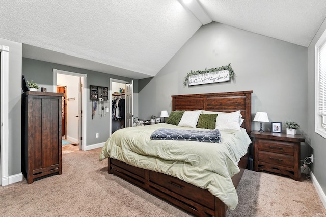 2906 Easton Ridge Pl, Fort Wayne, IN 46818 - bedroom with lofted ceiling, a walk in closet, carpet flooring, baseboards, and a closet