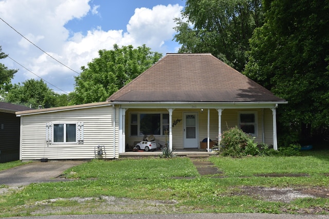 303 E N St, Winslow, IN 47598 - view of front of property with a porch, a front yard, and a shingled roof