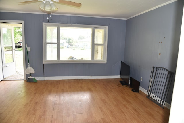 303 E N St, Winslow, IN 47598 - spare room with wood finished floors, a ceiling fan, baseboards, and ornamental molding