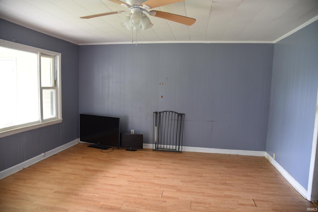 303 E N St, Winslow, IN 47598 - empty room with light wood-style floors, a ceiling fan, crown molding, and baseboards