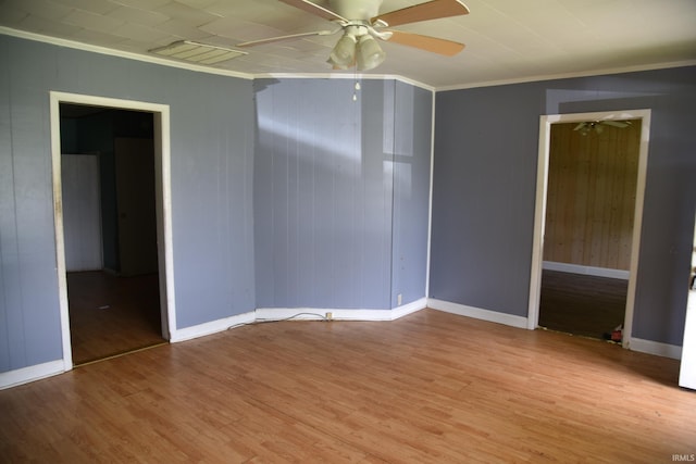 303 E N St, Winslow, IN 47598 - unfurnished room featuring ornamental molding, a ceiling fan, light wood-type flooring, and baseboards