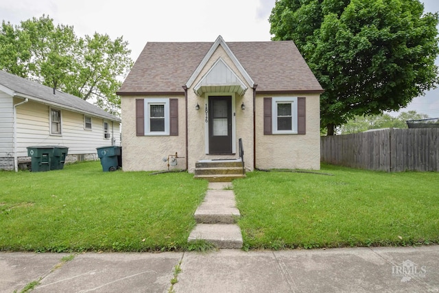 1816 W 13th St, Muncie, IN 47302 - view of front of property featuring roof with shingles and stucco siding