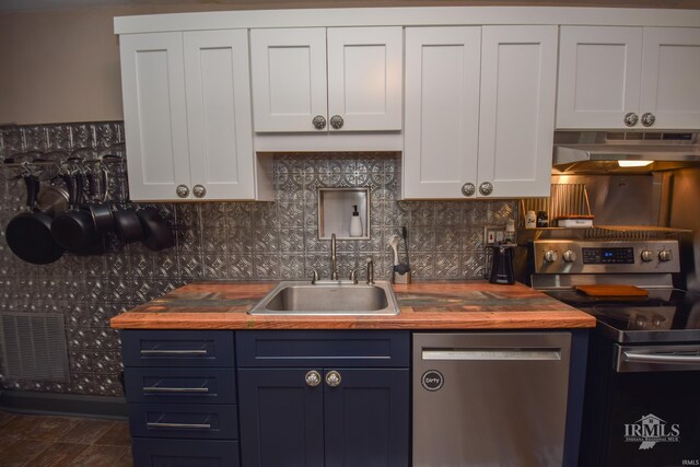 1816 W 13th St, Muncie, IN 47302 - kitchen with stainless steel appliances, butcher block countertops, a sink, and under cabinet range hood