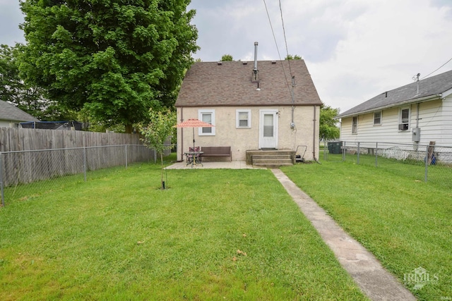 1816 W 13th St, Muncie, IN 47302 - rear view of property featuring stucco siding, central AC, and a patio